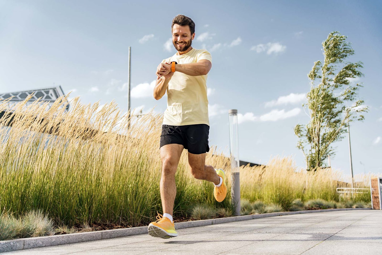 Happy,Man,Checking,Progress,On,Fitness,Watch,While,Running,,Tall Self Development